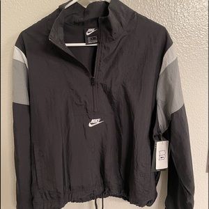 Women 1/2 zip windbreaker with tags.  Haven’t worn it, forgot I had.
